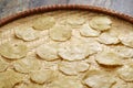 Emping, Indonesian crackers made from crushed Belinjo nuts. Drying on a bamboo tray.