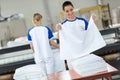 Employee agree ironing textiles Royalty Free Stock Photo