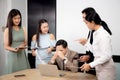 Employee angry and bullying boss while stress and pressure at the office, team businesspeople upset with manager during meeting. Royalty Free Stock Photo