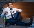 Employee asking for help and drinking under stress and despair Royalty Free Stock Photo
