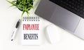 EMPLOYEE BENEFITS text on notebook with laptop, mouse and pen Royalty Free Stock Photo