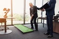 The employee came to the director with a report. Director plays golf in the office