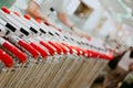 An employee driving a row of shopping carts. Selective focus Royalty Free Stock Photo