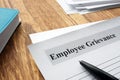 Employee Grievance form on an office desk Royalty Free Stock Photo