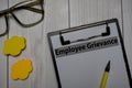 Employee Grievance write on a paperwork isolated on office desk