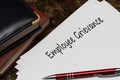 Employee Grievance write on a paperwork isolated on office desk Royalty Free Stock Photo