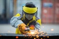 Employee grinding steel with sparks Royalty Free Stock Photo