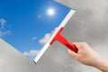 Employee hand cleaning a glass with squeegee Royalty Free Stock Photo