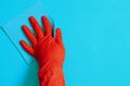 Employee hand in rubber protective glove with micro fiber cloth wiping wall from dust. Commercial cleaning company concept Royalty Free Stock Photo