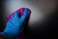 Employee hand in rubber glove with micro fiber cloth cleaning Royalty Free Stock Photo