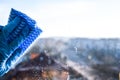 Employee hand in rubber protective glove with micro fiber cloth wiping window from dust. copy space, General cleaning Royalty Free Stock Photo