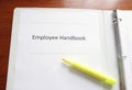 Employee Handbook on a desk