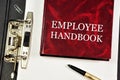 Employee handbook. Determines the human resources practices and labor laws. Royalty Free Stock Photo