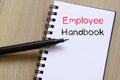 Employee handbook text concept on notebook Royalty Free Stock Photo