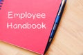 Employee handbook text concept on notebook Royalty Free Stock Photo