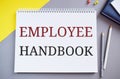 Employee Handbook text written in Notepad.Business photo text Document Manual Regulations Rules Guidebook Policy Code Royalty Free Stock Photo