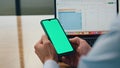 Employee hands holding greenscreen telephone at office closeup. Man using phone