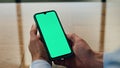 Employee hands holding mockup smartphone closeup. Entrepreneur read messages