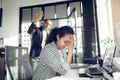 Employee having headache listening to angry boss Royalty Free Stock Photo