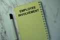Employee Involvement write on a book isolated on office desk
