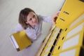 Employee looks for ring binder with accounting materials