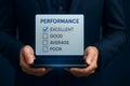 Employee performance evaluation checklist with excellent rating highlighted on screen Royalty Free Stock Photo