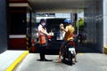 Employee with PPE serve food to customer at a drive thru facilty during the Covid 19 virus outbreak