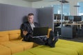 employee relaxes in the IT office chillout area