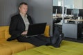 employee relaxes in the IT office chillout area