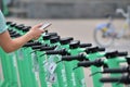 An employee of the rental service registers electric scooters in the city center