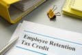 Employee retention tax credit papers and folder.