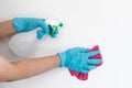 Employee`s hands were wiping the white walls, use a towel moistened with cleaning solution to rub the wall, Text fill area, White Royalty Free Stock Photo