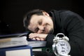 Sleeping peacefully at his workdesk