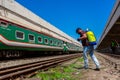 An employee sprays disinfectant on a outside of train as a precaution against a new coronavirus at Royalty Free Stock Photo