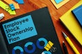 Employee Stock Ownership Plan ESOP and charts on the pages. Royalty Free Stock Photo