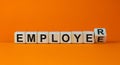 From an employee to an employer. Turned a cube and changed the word `employee` to `employer`. Beautiful orange background, cop Royalty Free Stock Photo