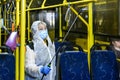 Employee of trolleybus park disinfects trolley cabin against the coronavirus COVID-19. Kyiv, Ukraine, March 12, 2020