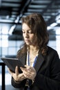 Employee uses device to review firewall rules, enforcing cybersecurity protocols