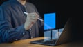 Employee using a laptop, interacting with digital checklist displayed as floating icons on the screen.
