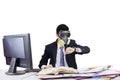 Employee wearing gas mask in workplace Royalty Free Stock Photo