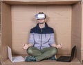 Employee wearing VR glasses meditating before starting work