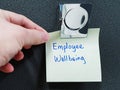 Employee wellbeing written on a piece of sticky pad