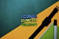 Employee Wellness Program text on top view color table background