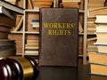 Employee and workers rights book with stack of documents. Royalty Free Stock Photo