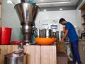 A employee working in coconut oil extraction mill at kochi Kerala india