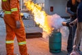 Employees firefighting training,Extinguish a fire Royalty Free Stock Photo