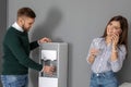 Employees having break near water cooler