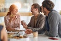 Employees having good time together at lunch break at company canteen. People, job, company, business concept Royalty Free Stock Photo