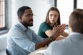 Employees listening to African American mentor speaking at briefing Royalty Free Stock Photo