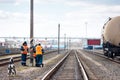 Employees of the railway depot make breaks in the work for recreation, while inspecting repairing railway rails in order to detect